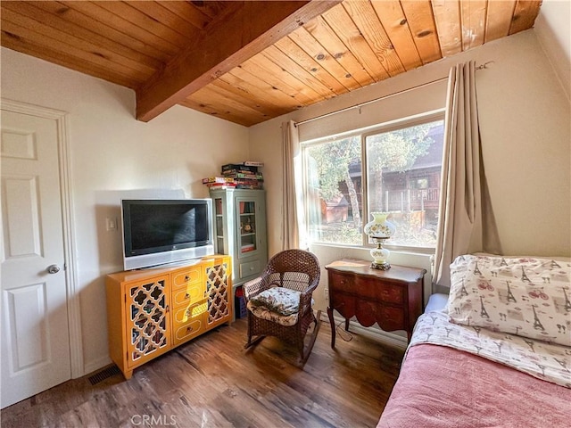 living area featuring beam ceiling, wood ceiling, and wood finished floors