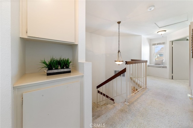 hallway with light carpet