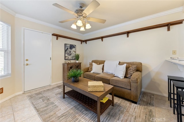 living room featuring ceiling fan, ornamental molding, and a wealth of natural light