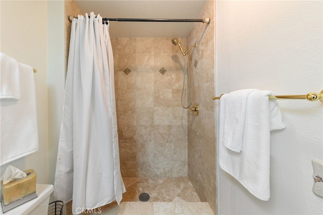 bathroom featuring a shower with curtain