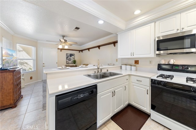 kitchen featuring white cabinets, kitchen peninsula, white gas range, black dishwasher, and crown molding