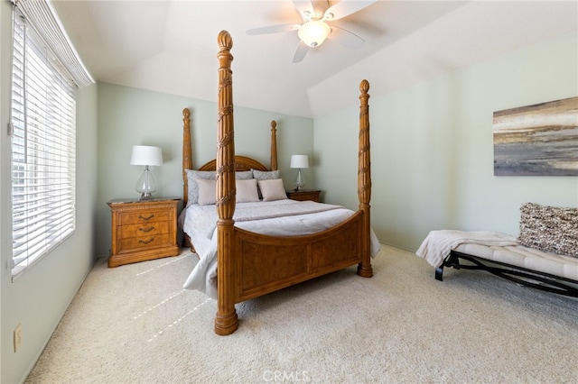 carpeted bedroom featuring vaulted ceiling and ceiling fan