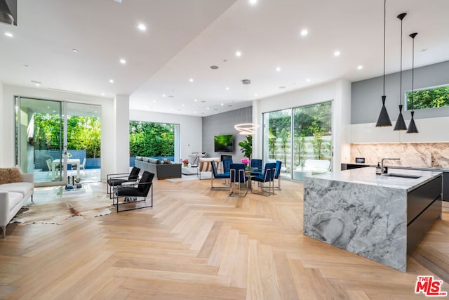 living room featuring sink and light parquet flooring