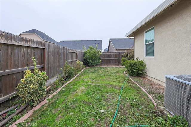 view of yard featuring central AC unit