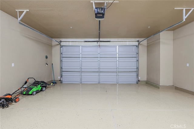 garage featuring a garage door opener