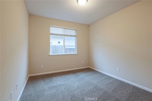 unfurnished room featuring carpet flooring