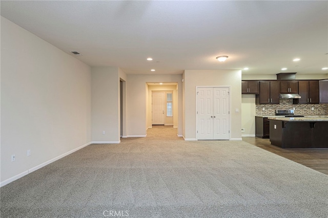 unfurnished living room with light carpet