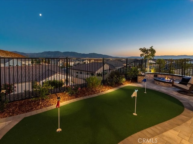 yard at dusk with a mountain view