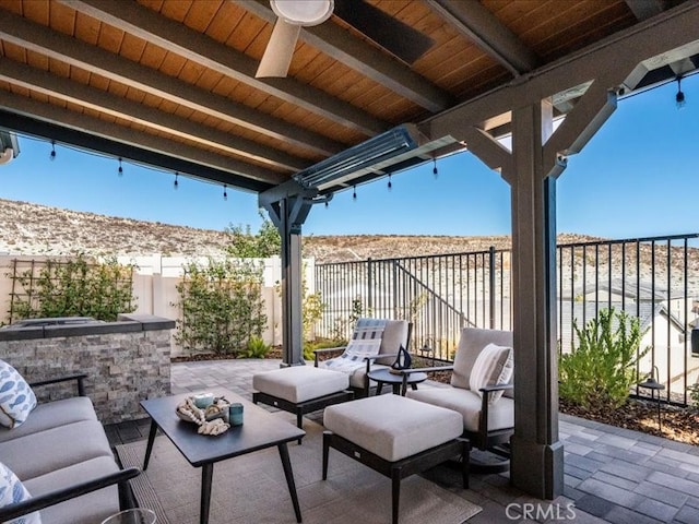 view of patio / terrace with outdoor lounge area and ceiling fan