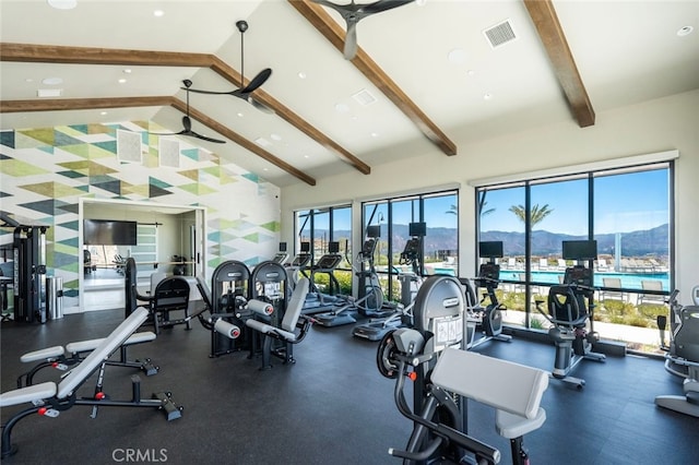 workout area featuring ceiling fan and high vaulted ceiling