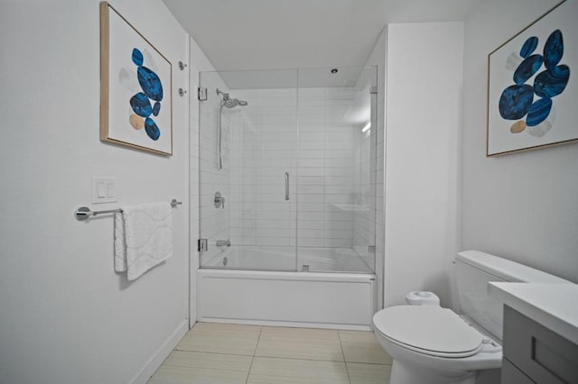 full bathroom with toilet, vanity, tile patterned flooring, and shower / bath combination with glass door