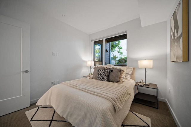 carpeted bedroom featuring vaulted ceiling