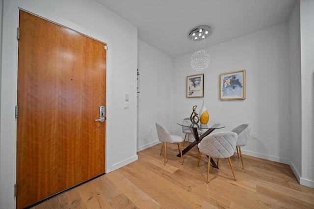 dining space with light wood-type flooring