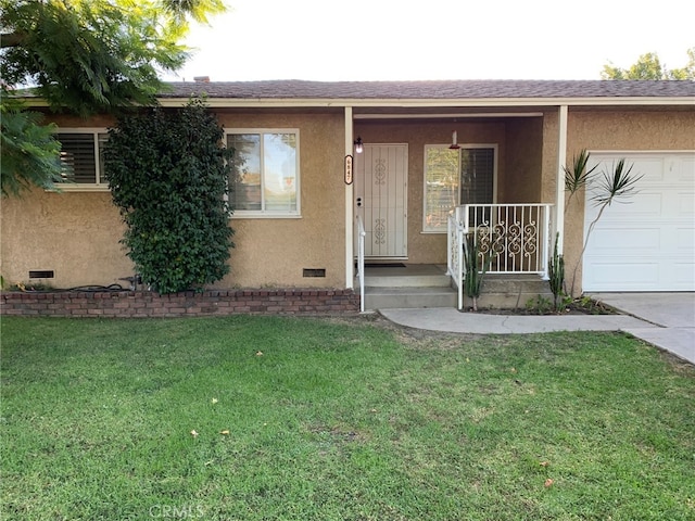 doorway to property featuring a garage and a lawn