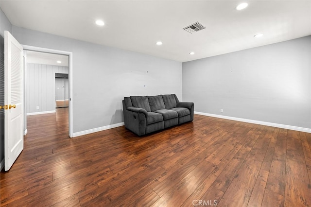 sitting room with dark hardwood / wood-style flooring