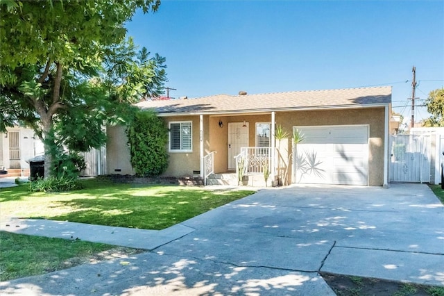 ranch-style home with a front yard and a garage