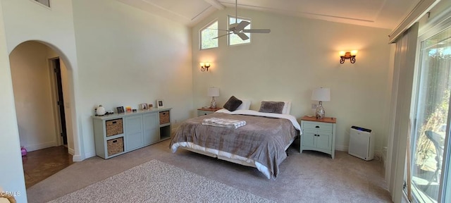 carpeted bedroom with ceiling fan and lofted ceiling with beams