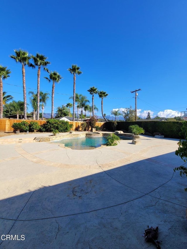 view of community featuring a patio area and a pool