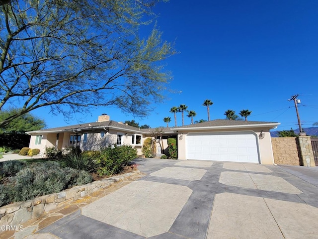 ranch-style home with a garage