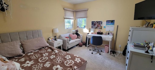 bedroom featuring light colored carpet