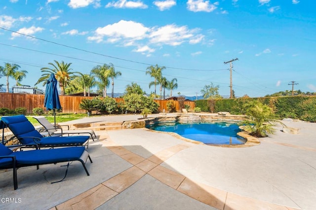 view of pool with a patio area, a fenced in pool, and a fenced backyard