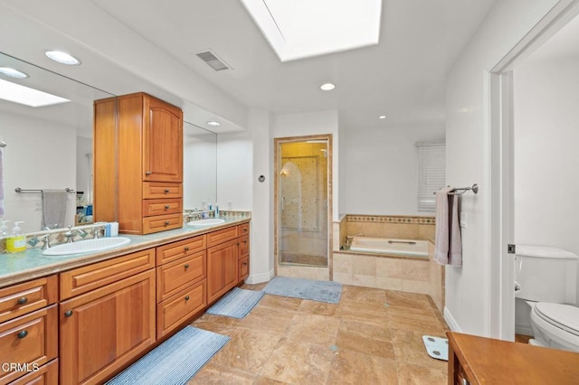 full bath with a garden tub, toilet, a stall shower, and a sink