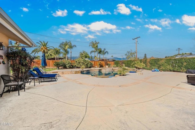 view of patio / terrace with a fenced backyard and a fenced in pool