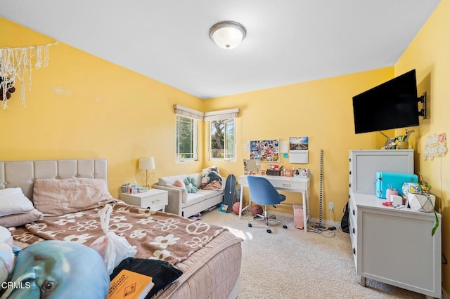 bedroom with carpet and baseboards
