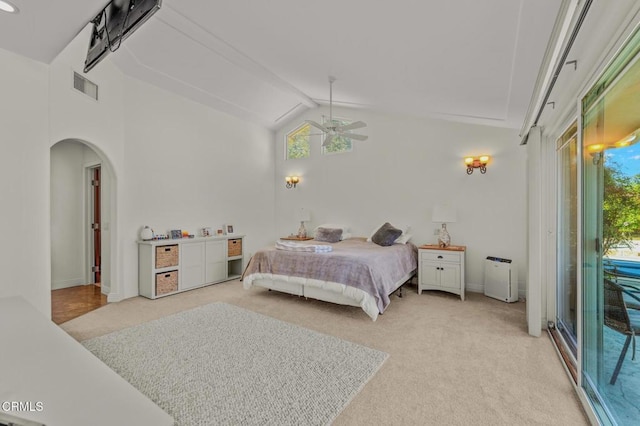 bedroom featuring visible vents, light carpet, multiple windows, access to outside, and vaulted ceiling