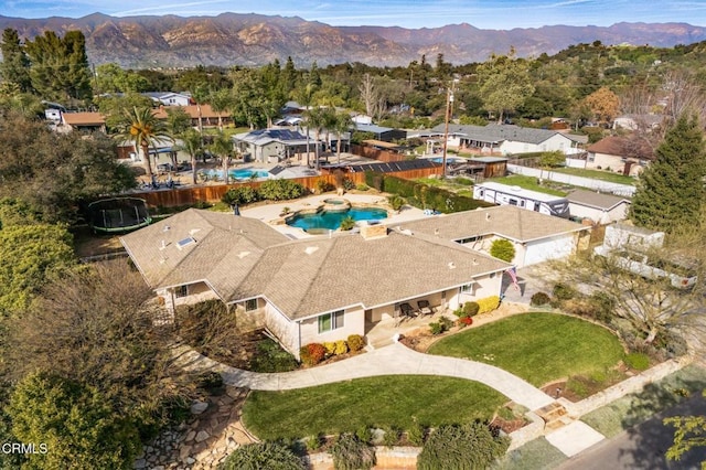 birds eye view of property featuring a mountain view