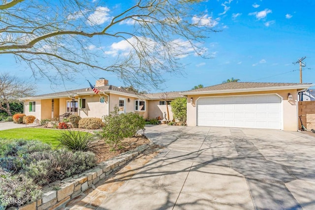 ranch-style home featuring stucco siding, an attached garage, a chimney, and driveway