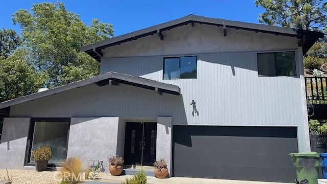 back of property featuring a garage