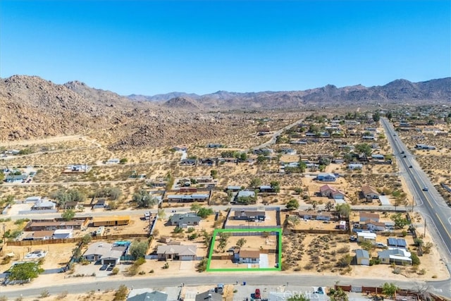 birds eye view of property featuring a mountain view