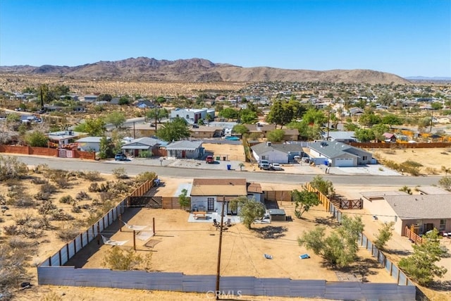 birds eye view of property featuring a mountain view