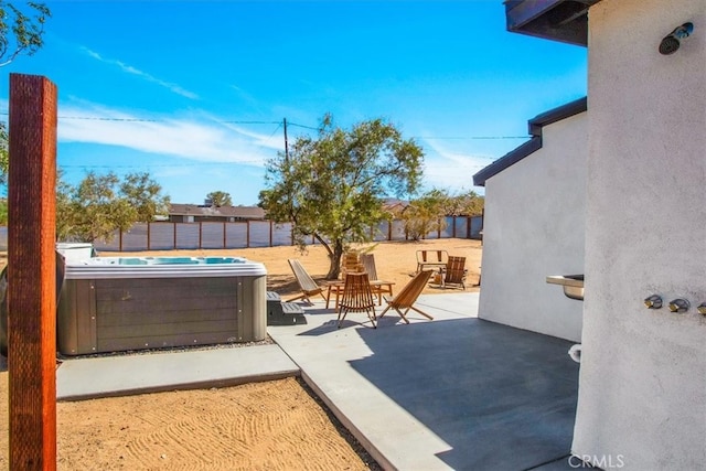 view of patio featuring a hot tub