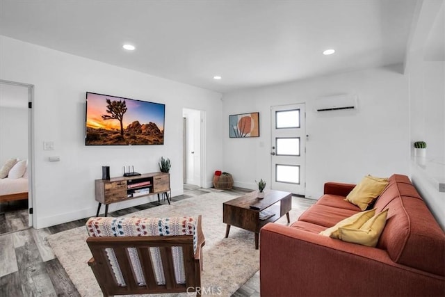 61853 Grand View Cir, Joshua Tree, CA 92252 - living area featuring baseboards, wood finished floors, recessed lighting, and a wall mounted air conditioner