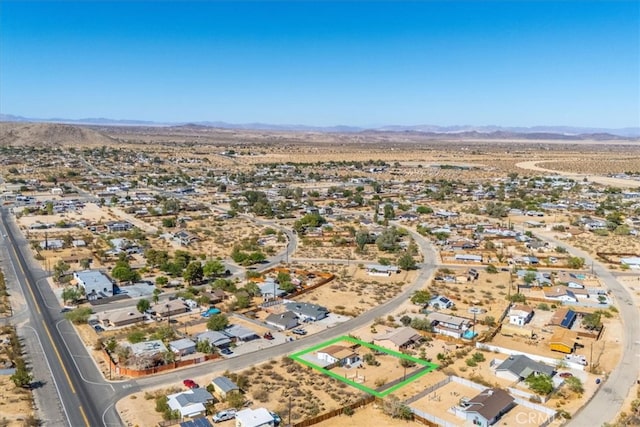 birds eye view of property featuring a mountain view