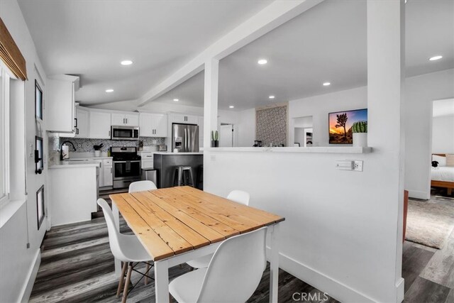 dining space featuring dark hardwood / wood-style flooring