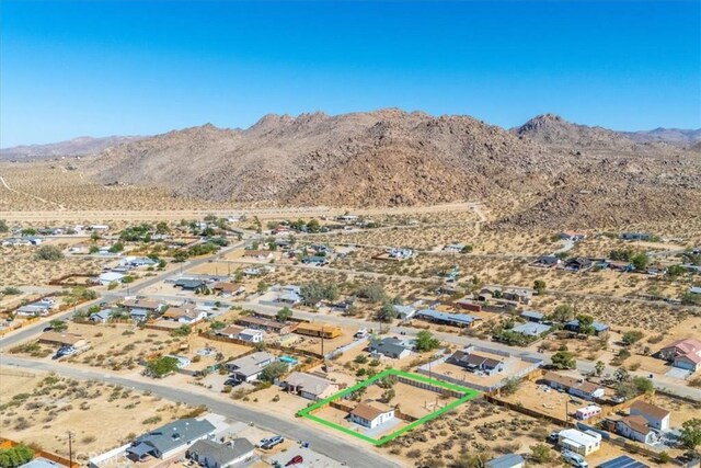 61853 Grand View Cir, Joshua Tree, CA 92252 - drone / aerial view with view of desert, a rural view, and a mountain view