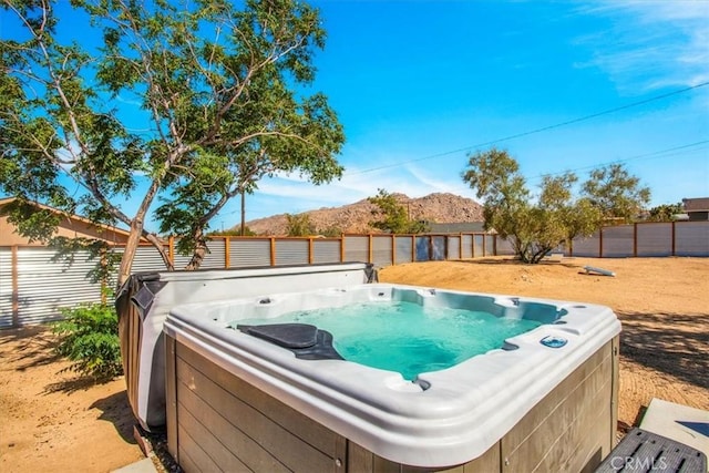 61853 Grand View Cir, Joshua Tree, CA 92252 - view of yard featuring a fenced backyard, a mountain view, and a hot tub