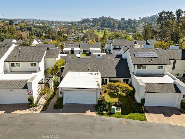 birds eye view of property with a residential view