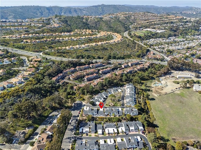 drone / aerial view featuring a residential view and a mountain view