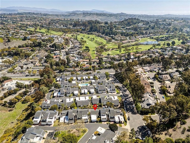 bird's eye view featuring a mountain view, view of golf course, and a residential view