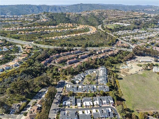 drone / aerial view with a residential view and a mountain view