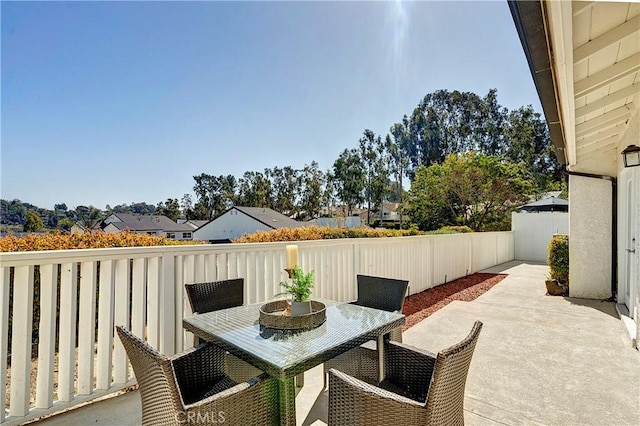 view of patio featuring fence and outdoor dining space