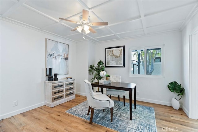 office featuring light wood-type flooring, coffered ceiling, a ceiling fan, and baseboards