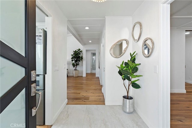 entryway with recessed lighting, baseboards, and light wood finished floors