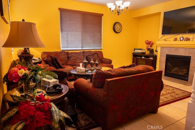 living room with a tiled fireplace and light tile patterned floors