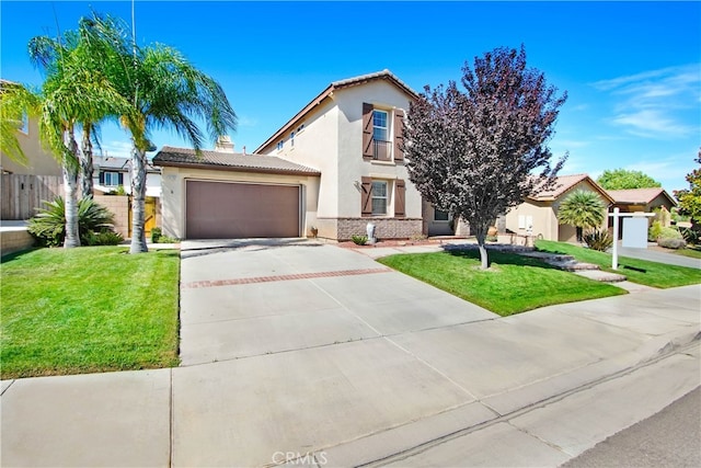 mediterranean / spanish home featuring a front yard and a garage