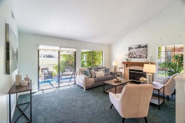 living room featuring high vaulted ceiling, a fireplace, and dark carpet